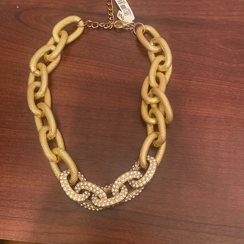 Gold necklace with diamonds on bottom